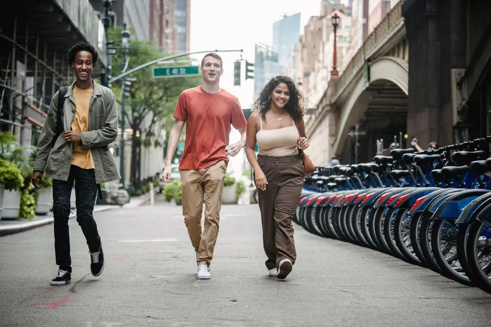 Friends walking together through a city